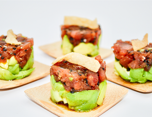 Mini Tuna Tartare — Tuna tartare served with fresh avocado, wontons, soy and ginger.
