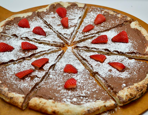 Nutella and Strawberry Pizza — Dessert pizza topped with Nutella and strawberries.