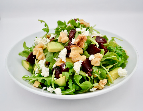 Arugula Dolce — Arugula, beets, avocado, goat cheese, dried cranberries, walnuts and balsamic-honey dressing.